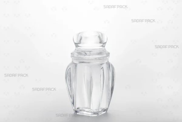 A three-quarter angle view of the Gohar 4 crystal container by Sadaf Pack, showcasing its clarity and elegant design for premium saffron packaging.