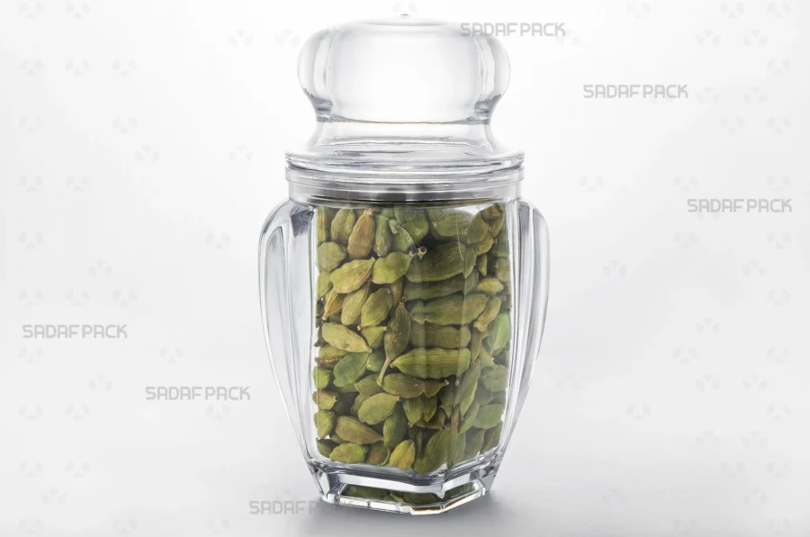 A Gohar 5 crystal container filled with high-quality cardamom, demonstrating its excellent product visibility for export.