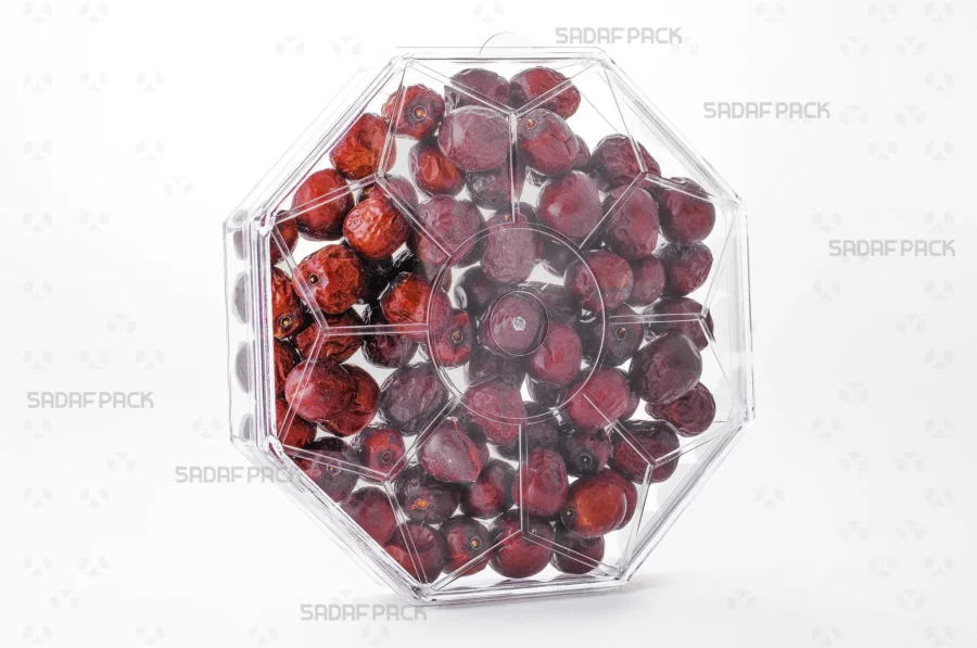 A three-quarter angle view of the Octagon Short container filled with Jujube, showcasing its suitability for luxury food exports. 