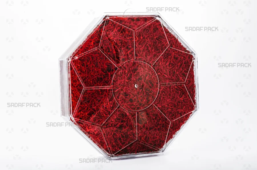 A three-quarter angle view of the Octagon Short container filled with saffron, showcasing its suitability for luxury food exports. 