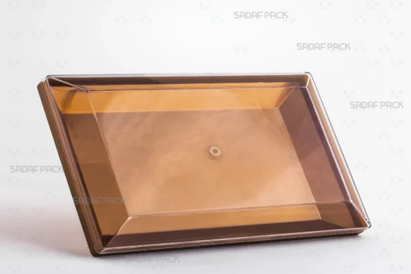 Three-quarter angle view of the elegant Rectangle 300 Gold container by Sadaf Pack, showcasing its gleaming finish and generous size for luxury food packaging.