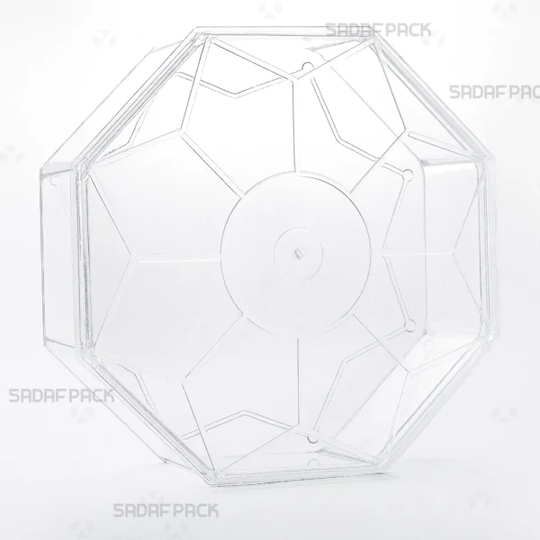 A three-quarter angle view of the Octangular Tall container by Sadaf Pack, showcasing its unique eight-sided design and clear polycrystal material.