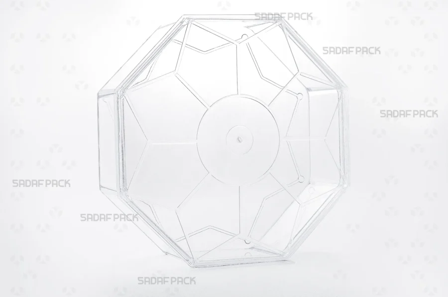 A three-quarter angle view of the Octangular Tall container by Sadaf Pack, showcasing its unique eight-sided design and clear polycrystal material.