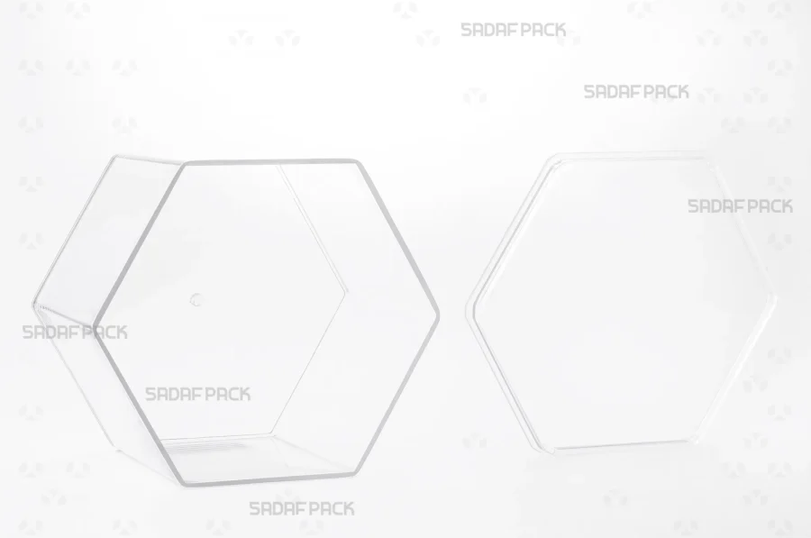 The Hexagon Tall container is displayed with its lid placed beside the base, revealing the spacious and deep interior perfect for holding luxury food items.