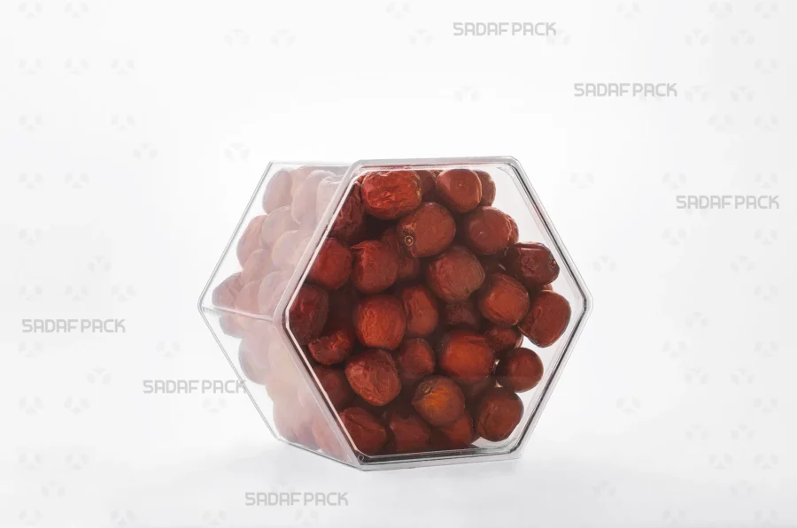 An elegant three-quarter angle view of the export-quality Hexagon Tall container filled with Jujube, highlighting its excellent product visibility.