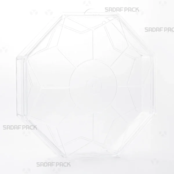 A three-quarter angle view of the Sadaf Pack Octagon Short crystal container, designed for premium packaging of sweets and nuts. 