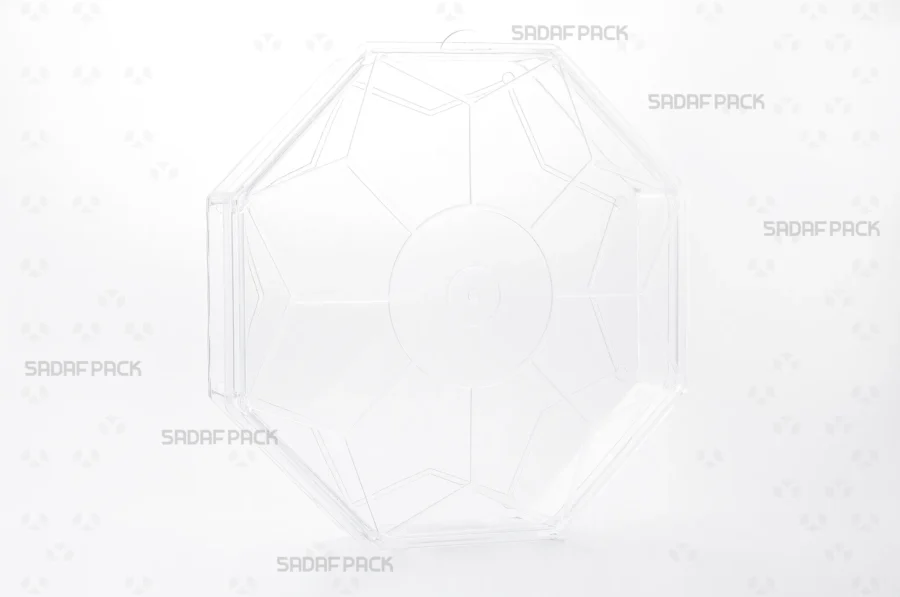 A three-quarter angle view of the Sadaf Pack Octagon Short crystal container, designed for premium packaging of sweets and nuts. 