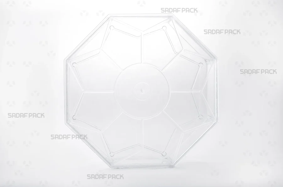 A front angle view of the Octagon Tall container, highlighting its tall structure and the precise geometric lines of its body and matching lid.