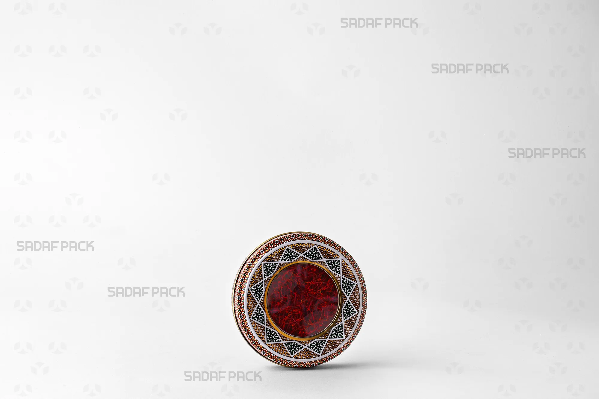 A three-quarter view of the 10 gram Metal Tin filled with saffron, ideal for export and preserving freshness.