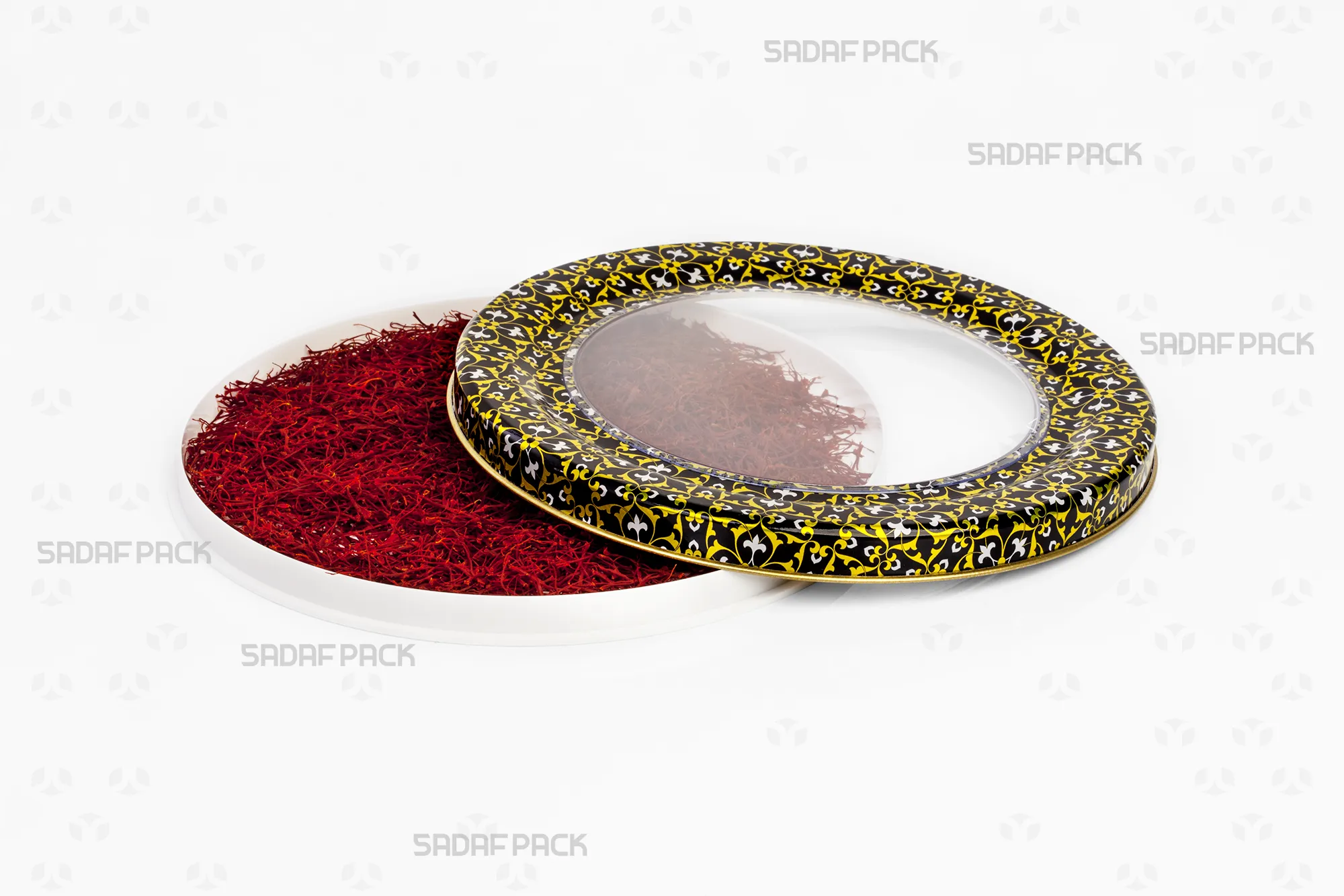 Top-down view of the Sadaf Pack 17 Metal España Flat Bottom tin with Black, Gold, and White design, shown with the lid open and filled with saffron to display its capacity and pattern.