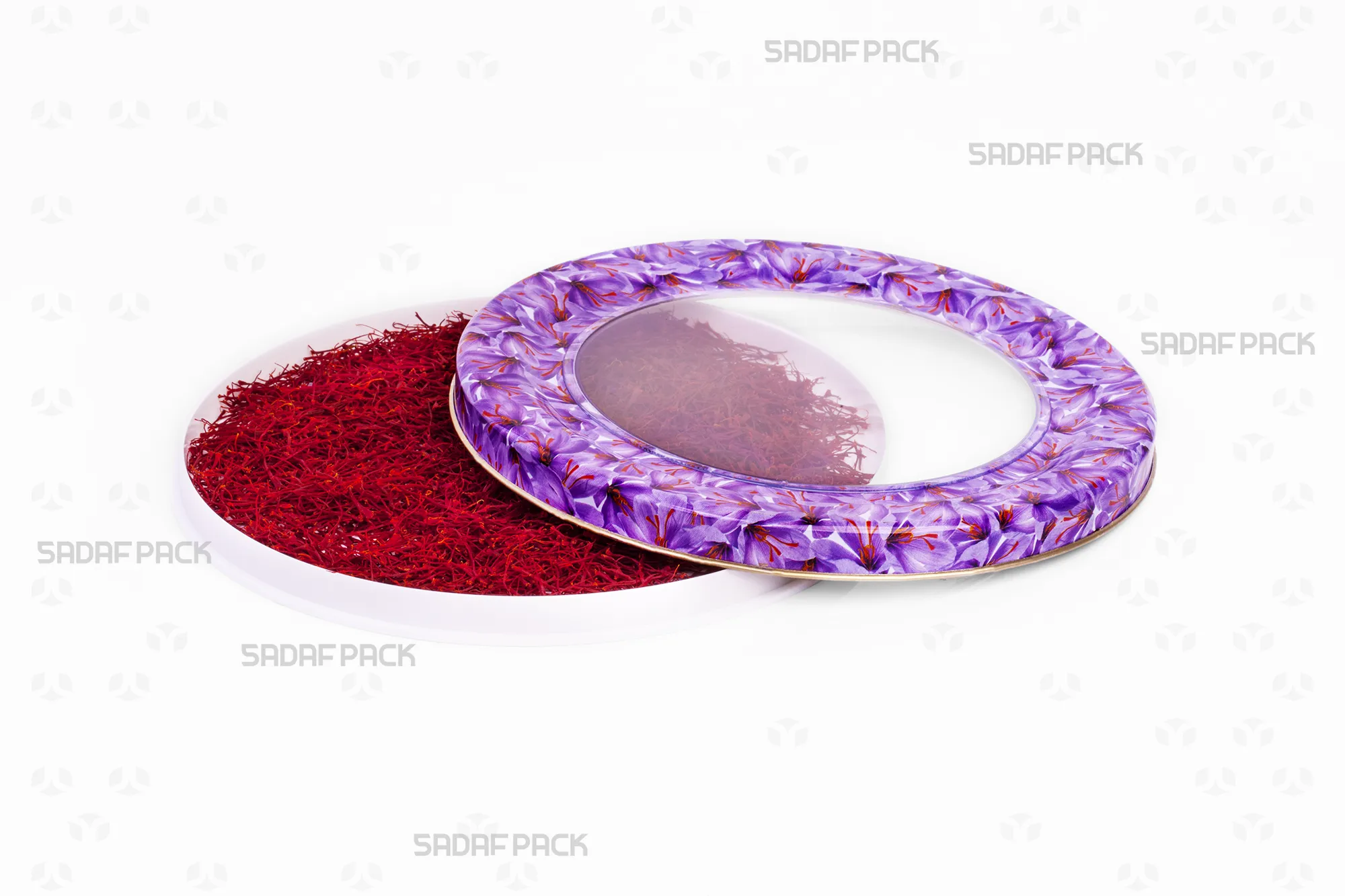 Top-down view of the 17 Metal España Raised Bottom tin by Sadaf Pack, showing the open lid beside the base filled with saffron, highlighting the Saffron Flower pattern.